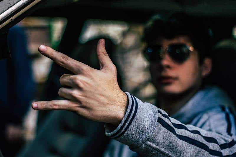 closeup man hands while sitting in car