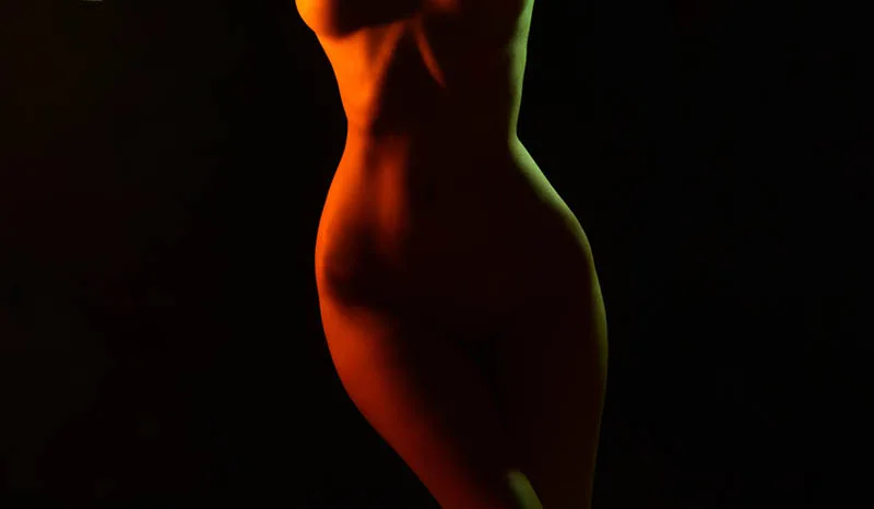low light of naked woman