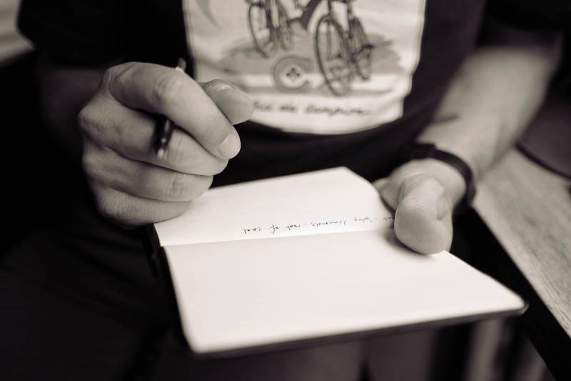 man writing on dashboard