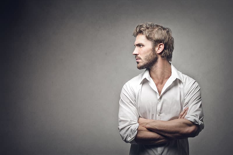 profile of handsome man on gray background