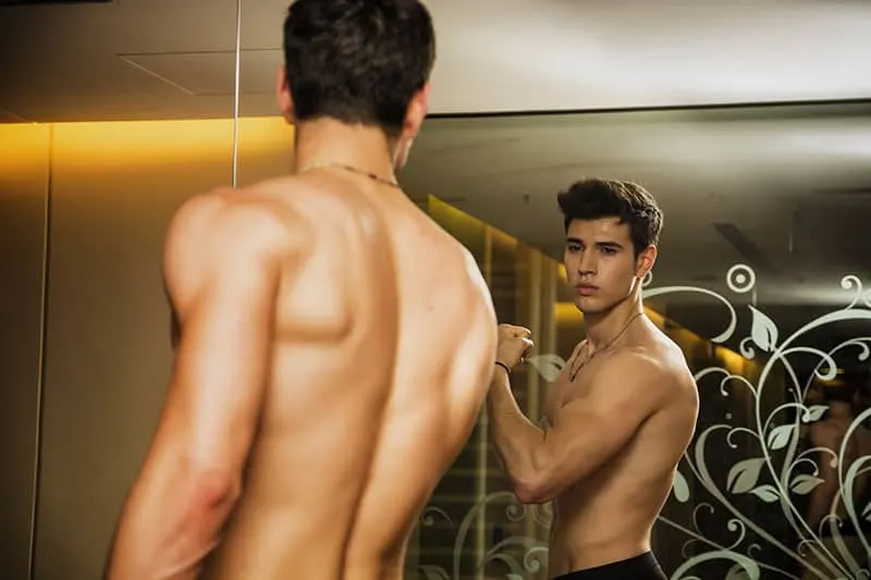 Young Shirtless Handsome Muscular Man Admiring Self