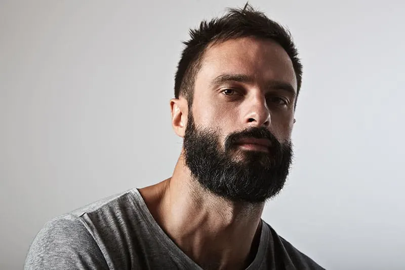 Close-up portrait of a brutal bearded man
