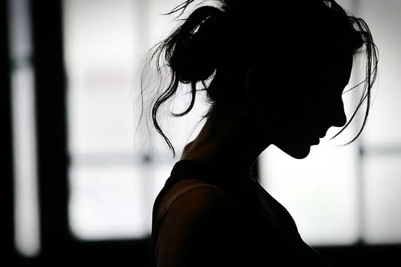 Silhouette of woman's head with waving hair