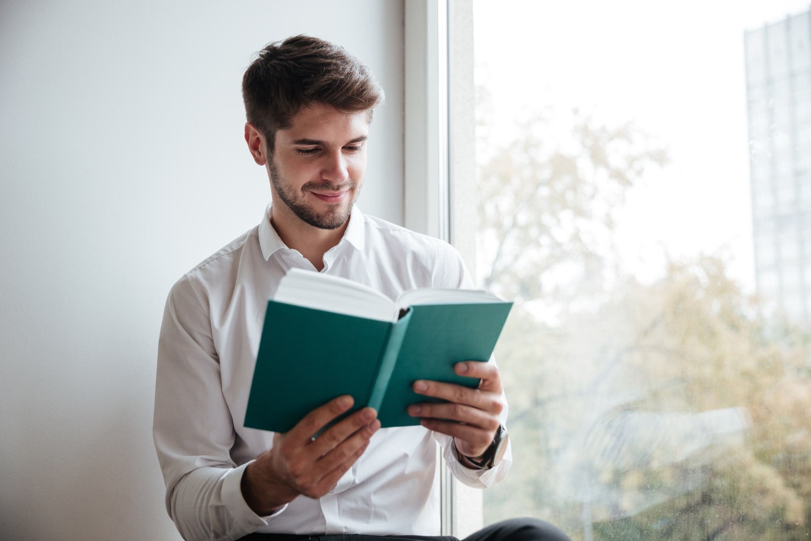 young man reading book