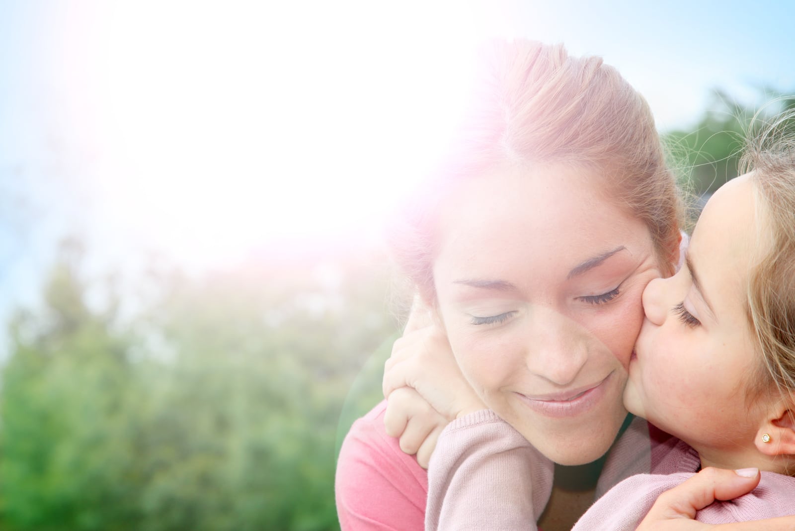 daughter kissing her mother