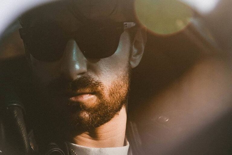 man with sunglasses in car