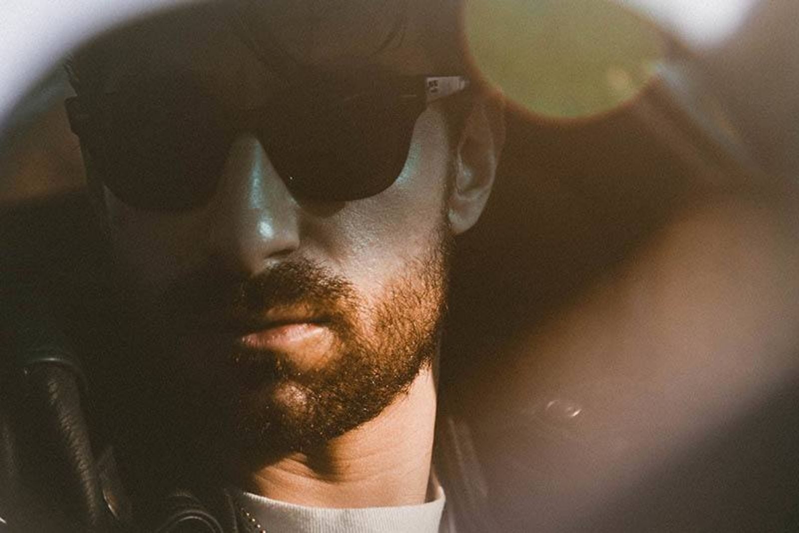man with sunglasses in car