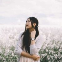 asian woman in white field