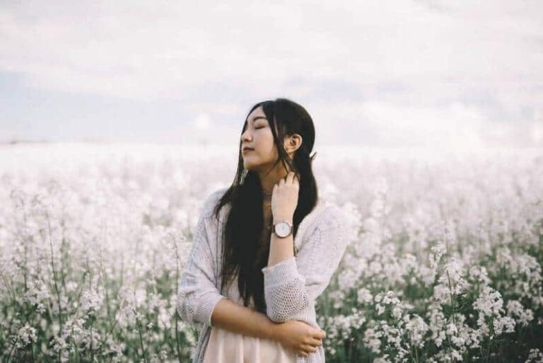 asian woman in white field