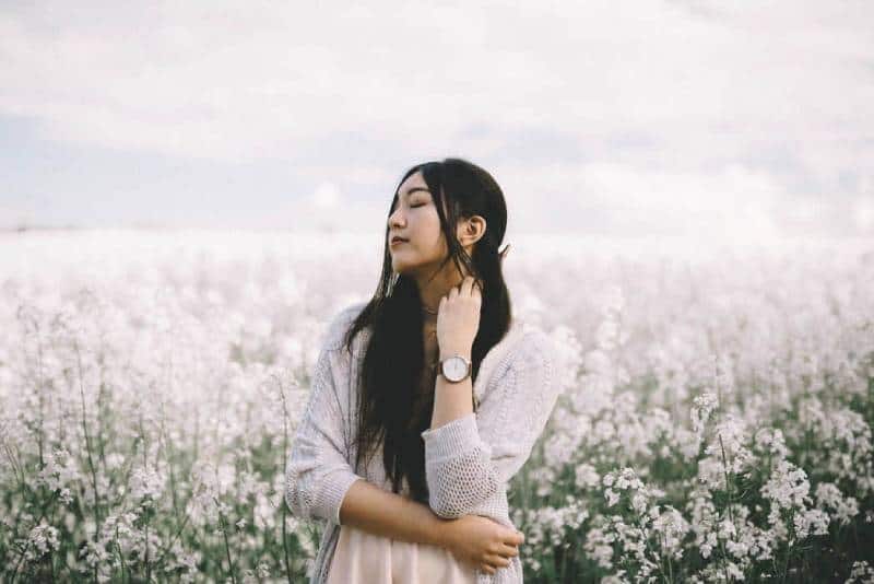 asian woman in white field