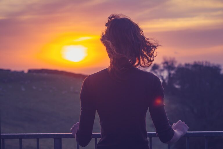 lonely woman watching the sunset
