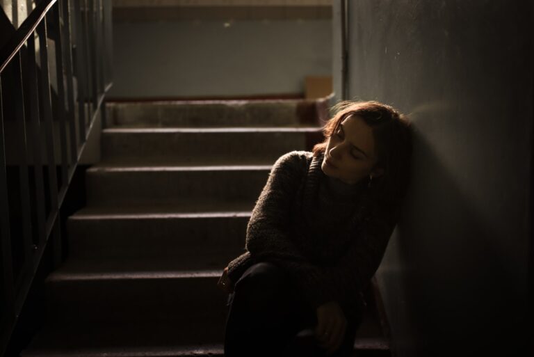 sad woman sitting in the dark