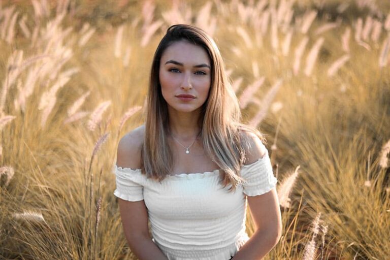 serious woman posing in the field