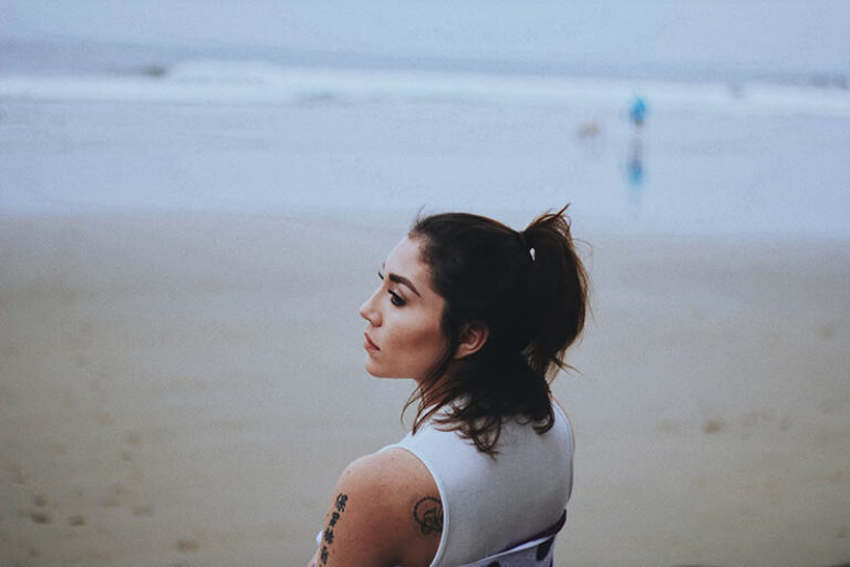 woman standing on the beach