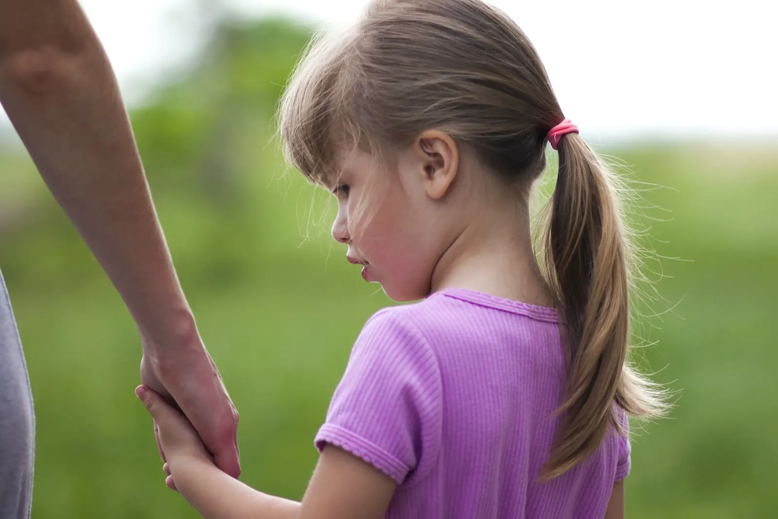 a person holding hands with girl