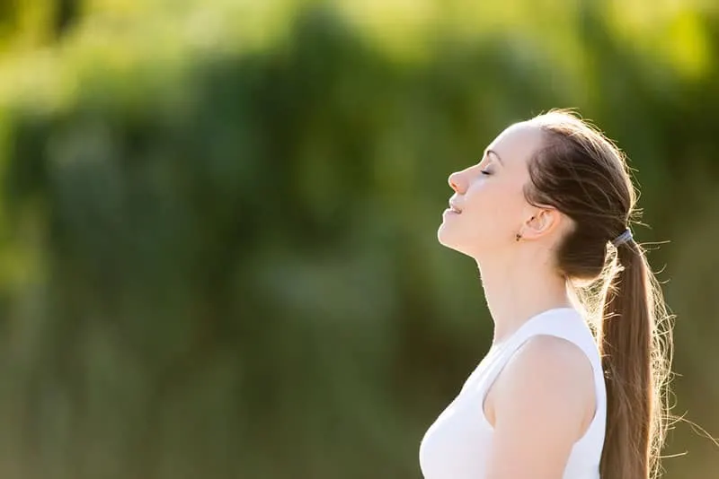 calm woman breathing deeply