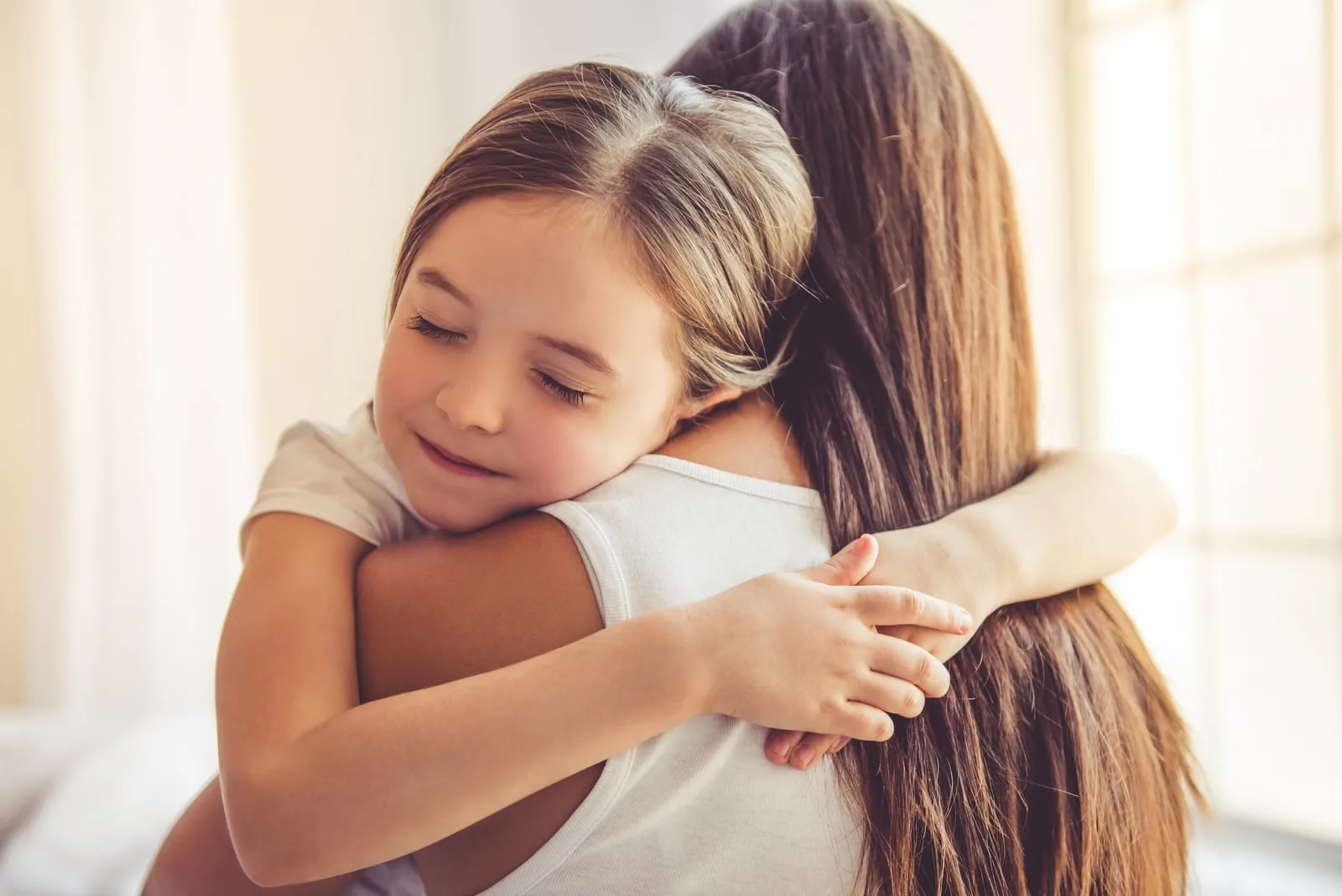 girl hugging her mother