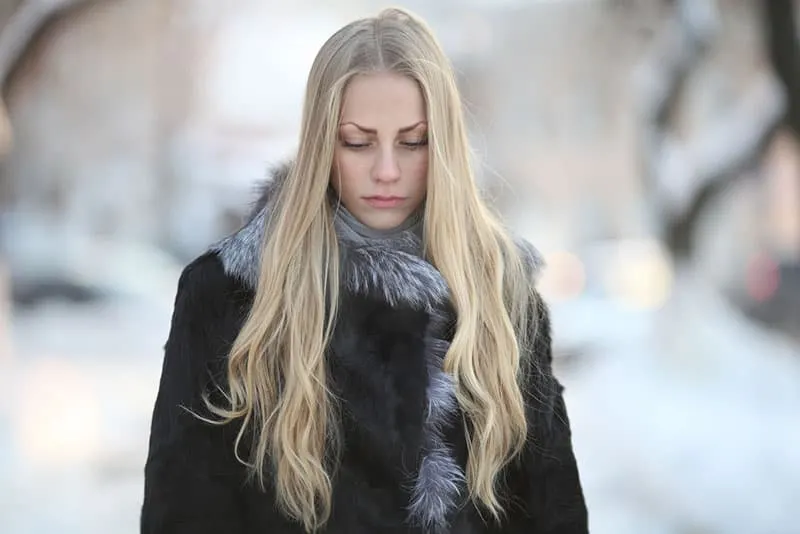 sad woman with long blond hair