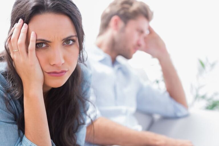 upset woman holding her head