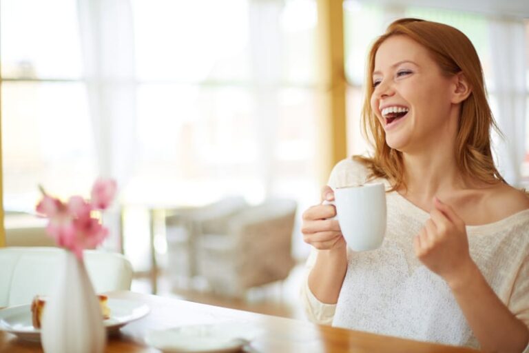 Image of young and pretty woman with cup of coffee