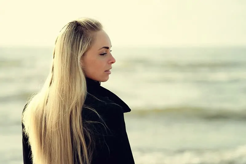 Portrait of a beautiful blonde outdoor on the sea