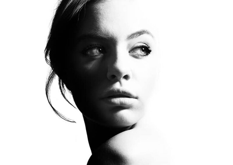 High contrast black and white portrait of a beautiful girl.