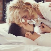 Lifestyle. Beautiful couple in bed