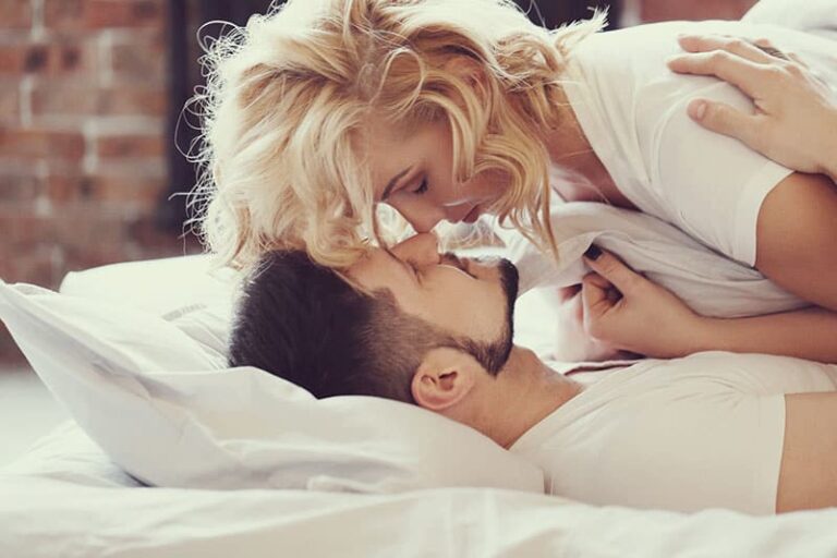 Lifestyle. Beautiful couple in bed