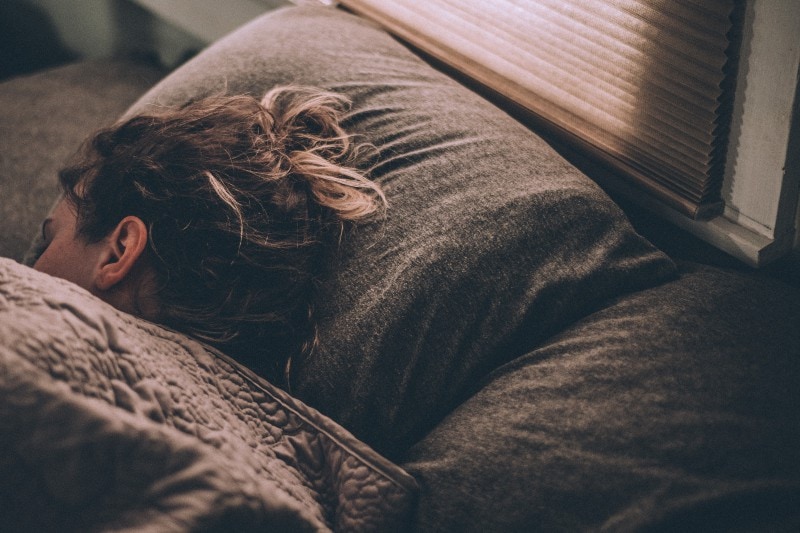 young tired woman sleeping