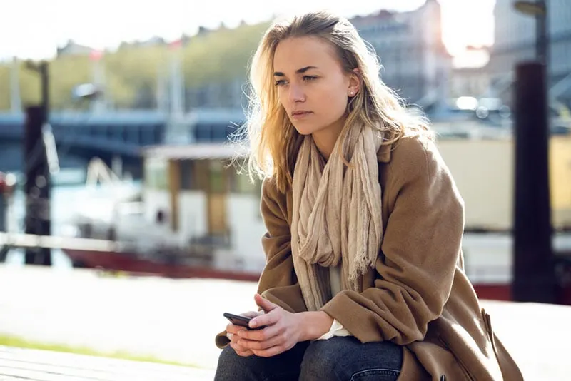 young woman sitting and waiting
