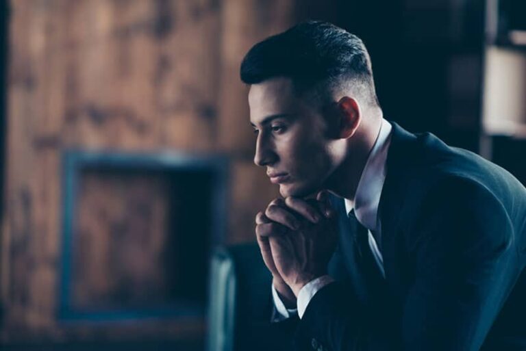 side view thoughtful man sitting at home