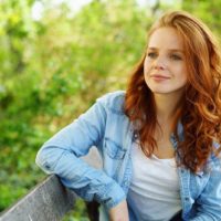 beautiful woman sitting on the bench