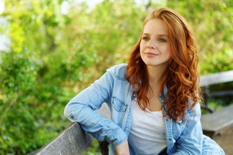 beautiful woman sitting on the bench
