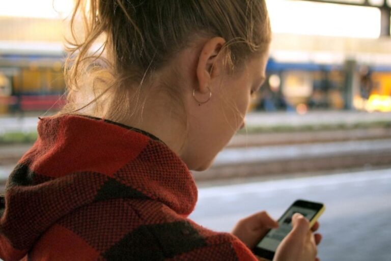 blonde woman key on phone