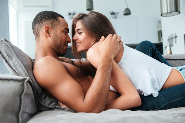 young couple enjoying on the couch