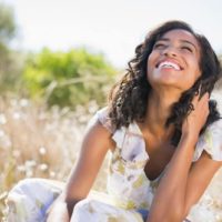 georgeous woman smiling in the meadow