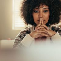 beautiful afro-american woman in deep thoughts