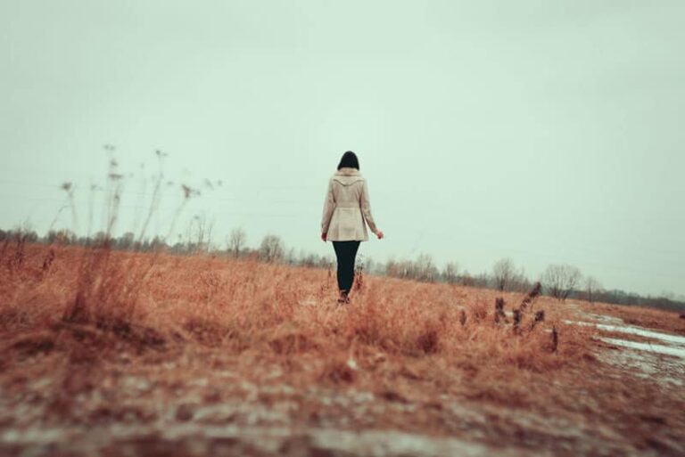 sad woman walking away