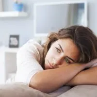 sad beautiful woman with blue eyes