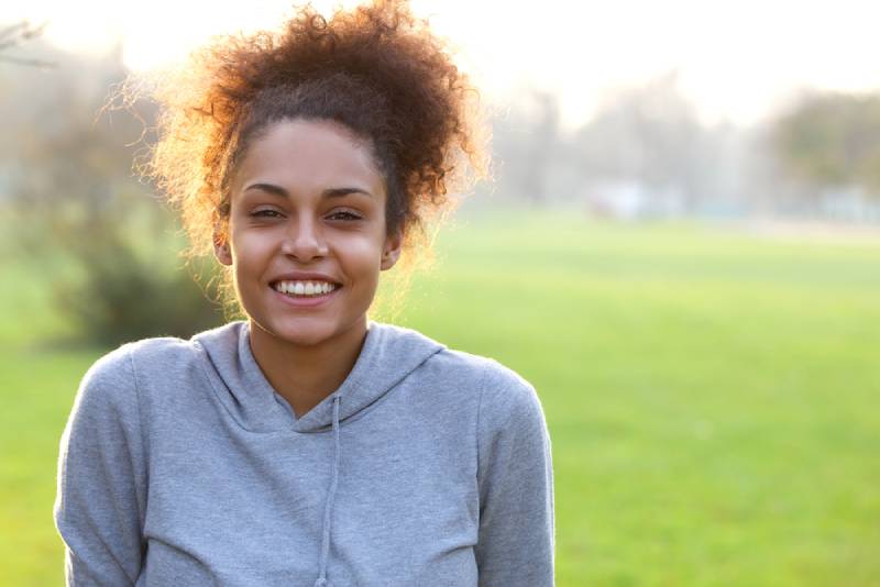 Portrait of a smiling young african american woman outdoor