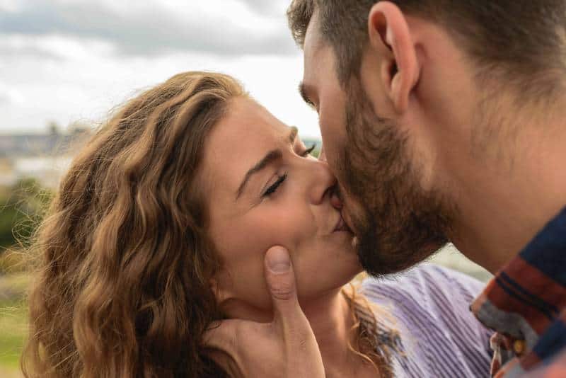 lovely couple kissing outside