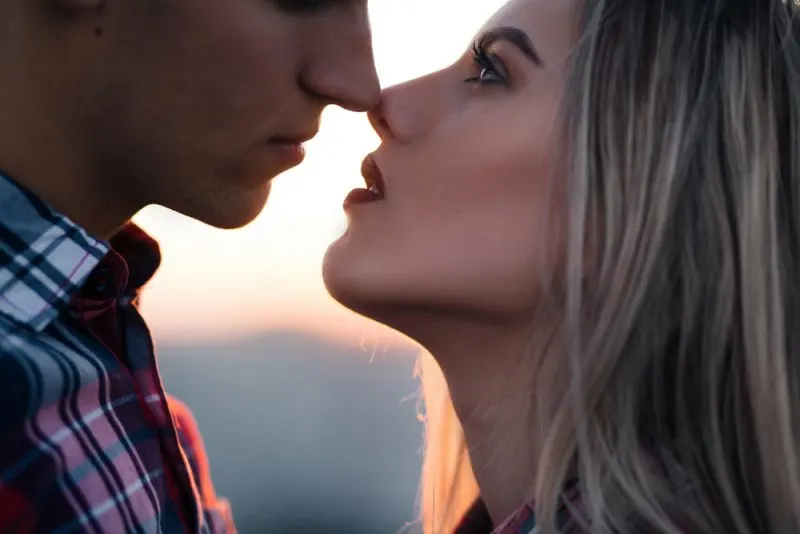 The lovely couple in love looking at each other