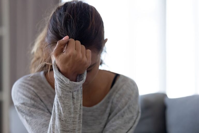 sad woman sitting alone