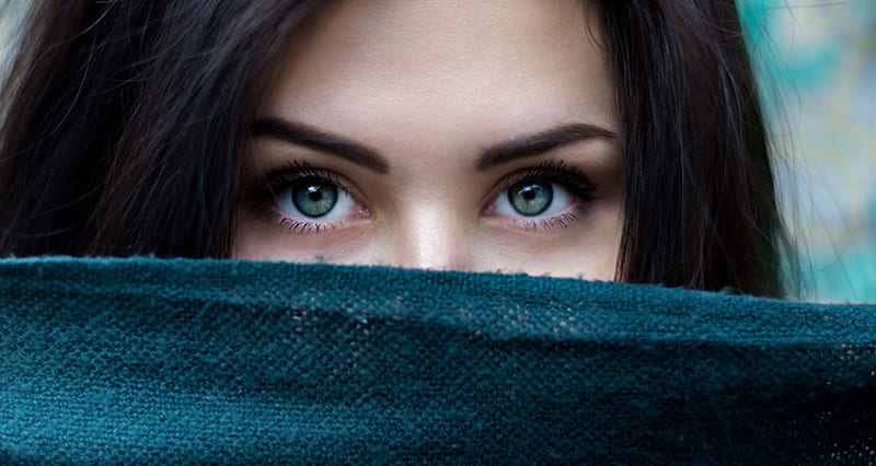 woman covering her face with a cloth