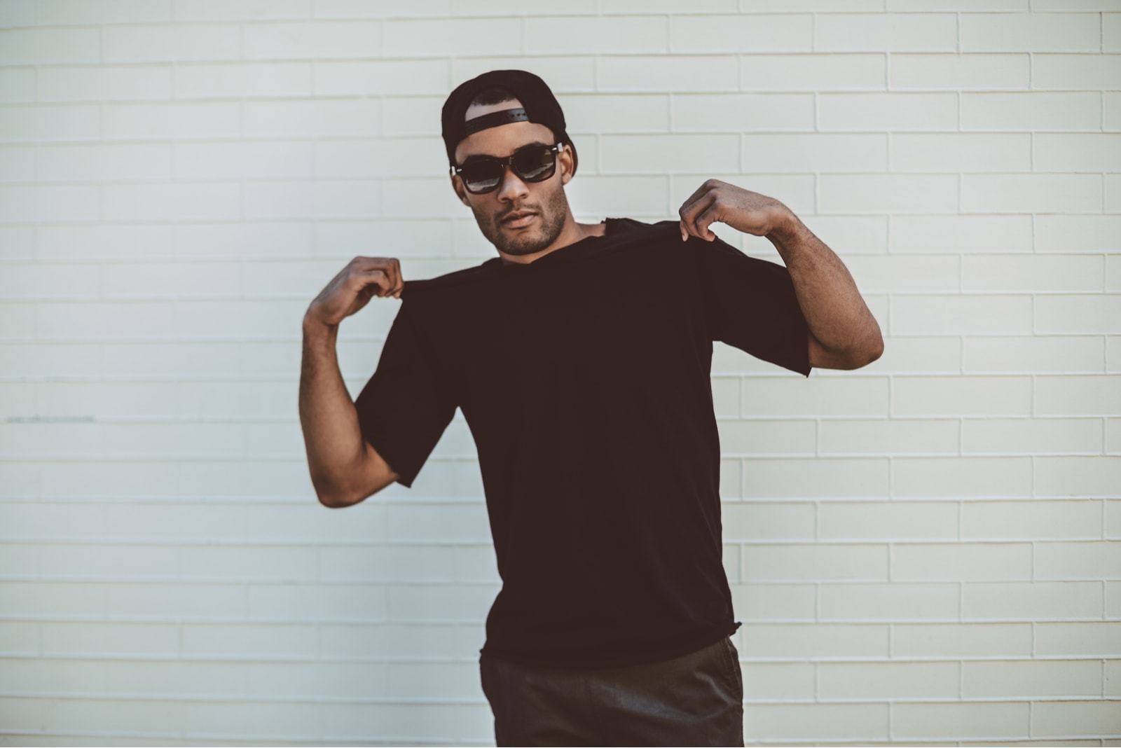 an attractive man in a black T-shirt