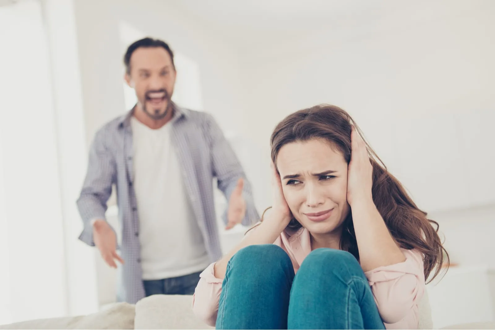 angry man yelling at woman