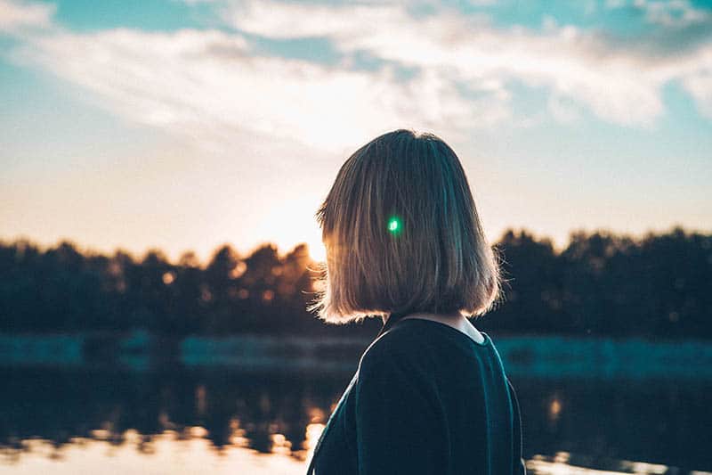 back view of blonde woman with short hair