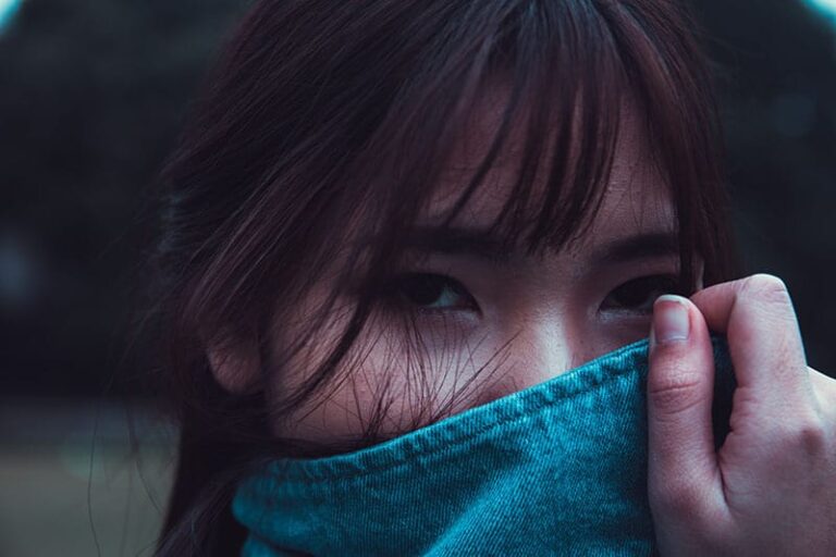 woman covering her face