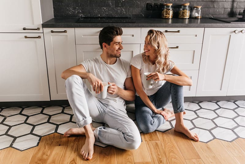 couple drinking coffee in the kitchen