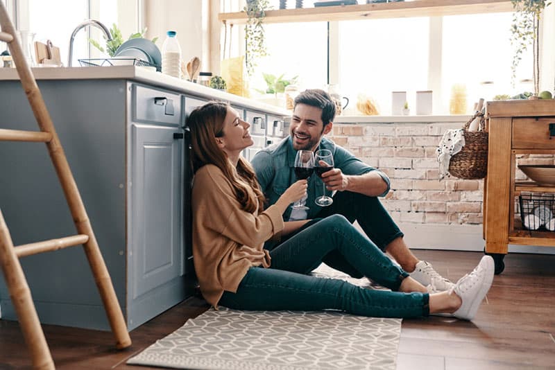 couple drinking wine in the kitchen